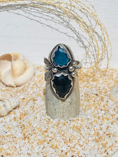 Double stone ring is set with faceted natural black onyx and blue apatite stones. Ring is embellished with handcrafted silver details. You will not be disappointed!  Ships within 1 to 2 business days. (Not including weekends or holidays)