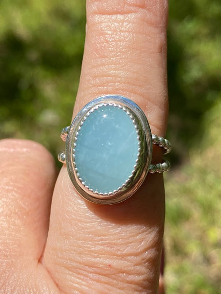 One of a kind handcrafted ring.  This stone though!!!!!! Could not capture the beauty of this stunning Peruvian Blue Opal. This is the kind of stone that you have to see in person, in the light, to appreciate its amazing blue color. Set in a sterling silver band with a light patina applied. Truly amazing!!!   Available in a US size 7.5