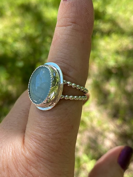 One of a kind handcrafted ring.  This stone though!!!!!! Could not capture the beauty of this stunning Peruvian Blue Opal. This is the kind of stone that you have to see in person, in the light, to appreciate its amazing blue color. Set in a sterling silver band with a light patina applied. Truly amazing!!!   Available in a US size 7.5