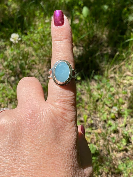 One of a kind handcrafted ring.  This stone though!!!!!! Could not capture the beauty of this stunning Peruvian Blue Opal. This is the kind of stone that you have to see in person, in the light, to appreciate its amazing blue color. Set in a sterling silver band with a light patina applied. Truly amazing!!!   Available in a US size 7.5