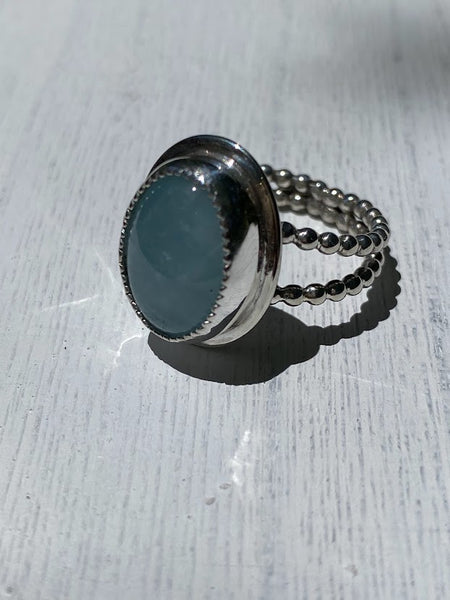 One of a kind handcrafted ring.  This stone though!!!!!! Could not capture the beauty of this stunning Peruvian Blue Opal. This is the kind of stone that you have to see in person, in the light, to appreciate its amazing blue color. Set in a sterling silver band with a light patina applied. Truly amazing!!!   Available in a US size 7.5