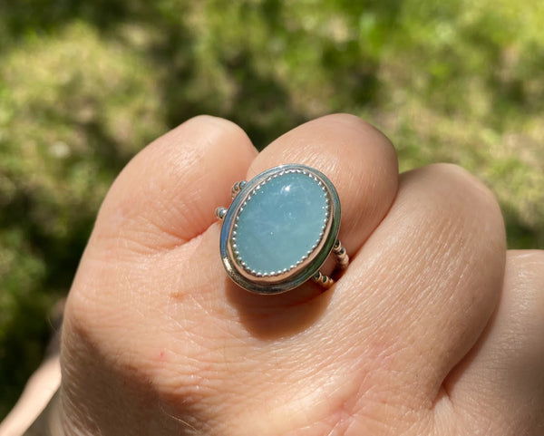 One of a kind handcrafted ring.  This stone though!!!!!! Could not capture the beauty of this stunning Peruvian Blue Opal. This is the kind of stone that you have to see in person, in the light, to appreciate its amazing blue color. Set in a sterling silver band with a light patina applied. Truly amazing!!!   Available in a US size 7.5