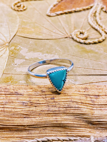 One of a kind handmade ring.  Beautifully handcrafted sterling silver ring set with a  natural, triangle shaped, gorgeous green turquoise stone- size 8   Delicate, smooth, sterling silver round band for an extremely comfortable fit.  Ships within 1 to 2 business days. (Not including weekends or holidays)