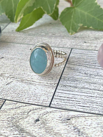 One of a kind handcrafted ring. This stone though!!!!!! Could not capture the beauty of this stunning Peruvian Blue Opal. This is the kind of stone that you have to see in person, in the light, to appreciate its amazing blue color. Set in a sterling silver band with a light patina applied. Truly amazing!!! Available in a US size 7.5