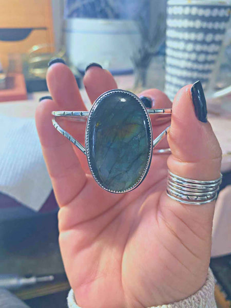  One of a kind handcrafted bracelet.  Sterling silver cuff bracelet set with a gorgeous natural green and blue labradorite stone.   Ships within 1 to 2 business days. (Not including weekends or holidays)  The Labradorite encourages you to go after your dreams, and helps you get out of your own way so you can make your dreams come true.