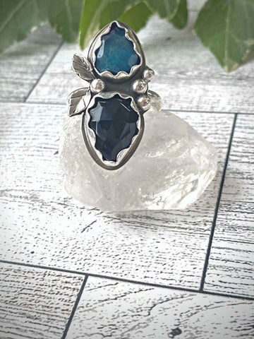 Double stone ring is set with faceted natural black onyx and blue apatite stones. Ring is embellished with handcrafted silver details. You will not be disappointed!  Ships within 1 to 2 business days. (Not including weekends or holidays)