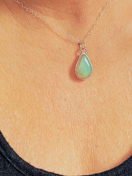 One of a kind handcrafted necklace.  Handcrafted sterling silver necklace, set with an unbelievably beautiful Peruvian Blue Opal. Caribbean sea blue pairs perfectly with the serrated bezel and delicate silver chain.  Ships within 1 to 2 business days. (Not including weekends or holidays)  This stone is said to infuse you with courage and determination and also alleviate the physical effects of stress.