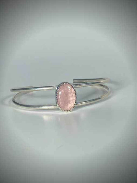 One of a kind handcrafted bracelet.  Beautifully handcrafted sterling silver cuff bracelet, set with a stunning natural Pink Morganite gemstone.  Pictures do not do this stone justice. This eye-catching pink morganite stone absolutely shimmers in the light with a beautiful pink color. Gorgeous!!