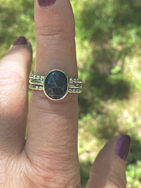 One of a kind handcrafted ring.  This beauty is a 3 band sterling silver ring set with a natural Spiderweb Obsidian stone. Beautiful grayish black stone looks so pretty up against bright silver setting. Available in a US size 8.  Ships within 1 to 2 business days. (Not including weekends or holidays)  Like its name, this stone has a spiderweb pattern. Nothing scary or creepy about this spiderweb. The spiderweb design is said to snare good luck without letting go. Yes please!! 